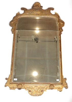 Lot 820 - ~ A George I Gilt and Gesso Pier Glass, circa 1720, the bevelled mercury plate within a moulded...