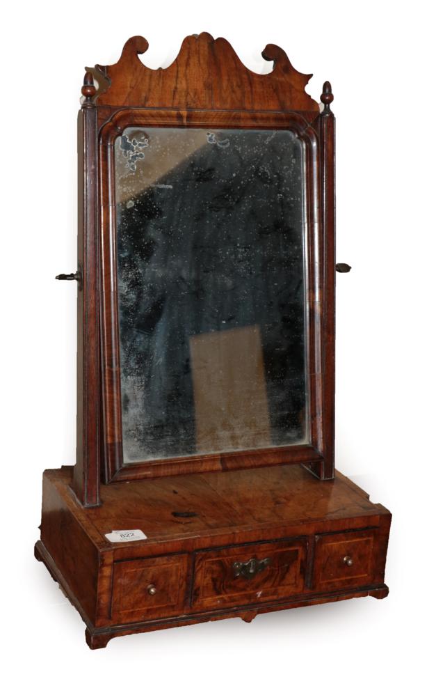 Lot 822 - ~ An Early 18th Century Figured Walnut and Featherbanded Dressing Mirror, the mercury plate...