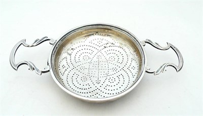 Lot 1150 - A George II Lemon Strainer, Edward Aldridge, London 1751, of circular form with scroll handles...