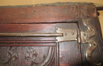 Lot 701 - A 17th Century Joined and Carved Oak Cupboard, with four hinged doors carved with sixteen...