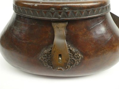 Lot 2025 - A good 18th century leather pot-bellied fishing creel, the hinged cover tooled with a sunburst...