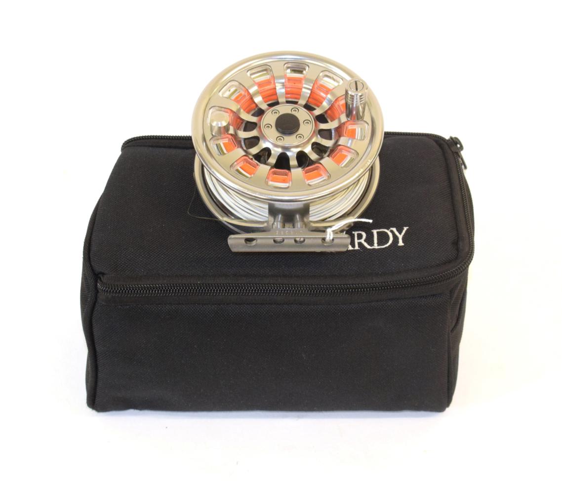 Lot 2028 - A Hardy Demon 7000 aluminium fly reel, serial No. J18385, fitted with line, with two spare...