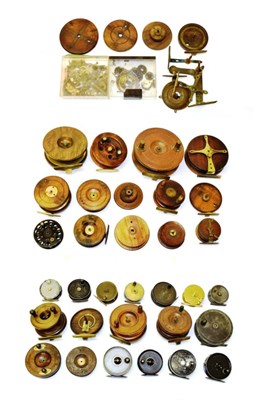 Lot 2049 - An accumulation of part-restored fishing reels, including a quantity of Nottingham-type examples in