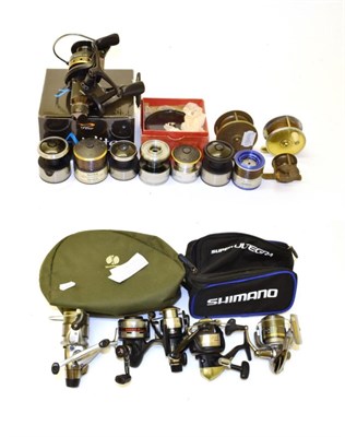 Lot 2064 - Six modern Shimano spinning reels, together with seven various Shimano spare spools and four...