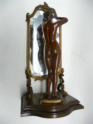 Lot 1159 - Emile Pinedo (1840-1916): A Bronze Figure of a Nude Girl, standing on a cushion arranging...