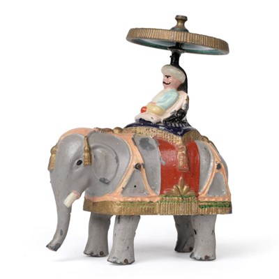 Lot 2402 - Britains Early Friction Elephant slush cast in lead with seated  figure beneath gyroscopic...