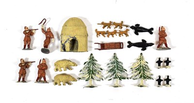 Lot 2421 - Timpo Arctic Series four figures, a musher, sled and dogs (dog train broken in half), three...