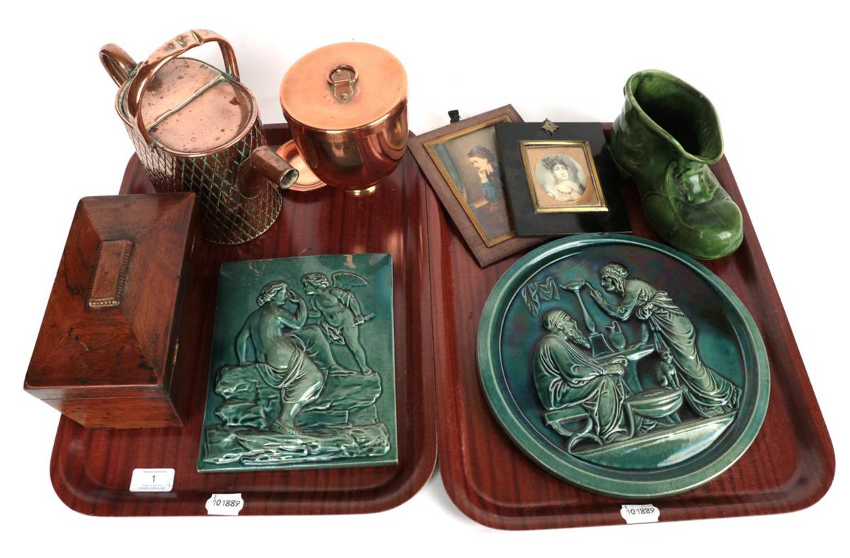Lot 1 - Two early 20th century green glaze moulded plaques; a copper ice cream bombe; a copper watering...