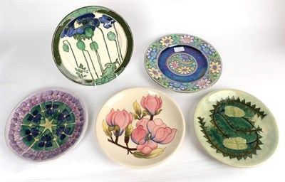 Lot 2 - Three Moorcroft plates; together with a Royal Doulton secessionist plate and a Maling plate (5)