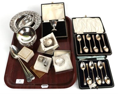 Lot 21 - A group of silver items to include cased teaspoons; a pair of George III tablespoons; napkin rings