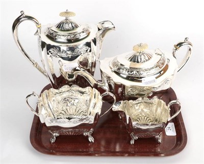 Lot 24 - A plated four-piece tea service, with mother of pearl finials and ivory insulators, the hot...