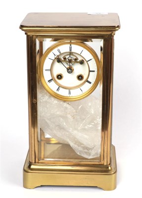 Lot 25 - A brass four glass striking mounted clock