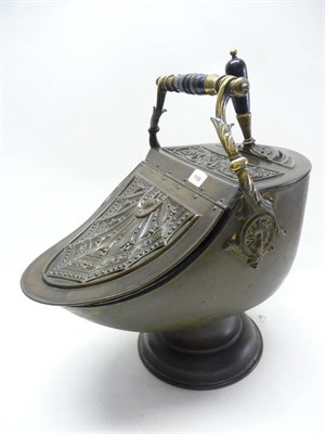 Lot 1196 - A Late Victorian Stamped Brass Coal Perdonium, of helmet form with overhead ebonised handle,...