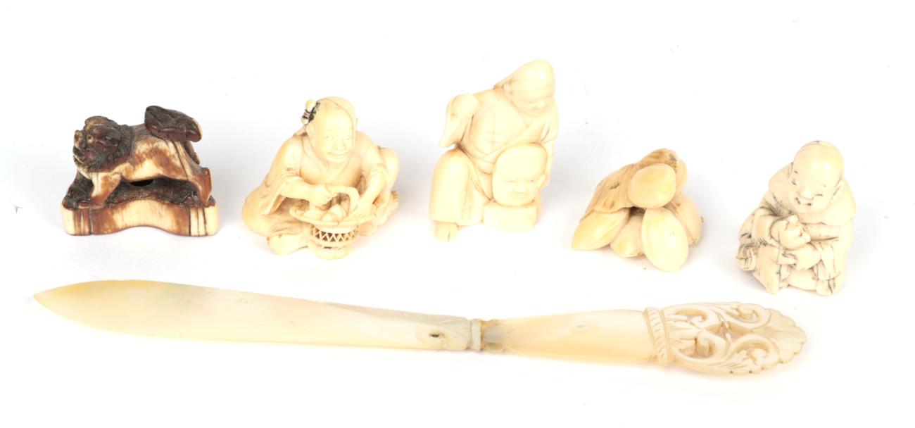 Lot 47 - Five early 20th century Japanese netsukes including a marine ivory example; and a mother of...