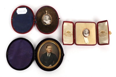 Lot 51 - Two photographic portrait miniatures in gold coloured frames and fitted cases; and a further...