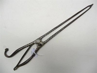 Lot 1198 - A Steel Ember Tongs, 17th/18th century, the handles with single mushroom knop and plain spring,...