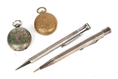 Lot 57 - A silver and enamel sovereign case; a base metal example; and two hallmarked silver pencils (4)