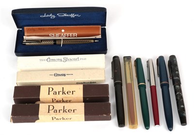 Lot 58 - A collection of pens including: a Conway Stewart fountain pen with nib stamped 14ct, The Conway...