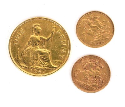 Lot 59 - A 1913 half sovereign, a 1902 half sovereign and a 1947 gilt penny (3)