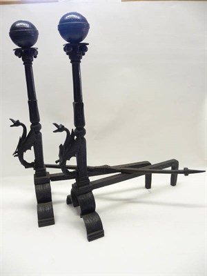 Lot 1199 - A Pair of Iron Fire Dogs, in 16th century style, with ball finials on fluted columns with leaf...