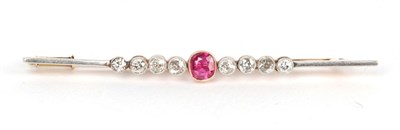 Lot 69 - A ruby and diamond set bar brooch, unmarked, length 6.4cm