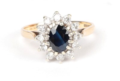 Lot 76 - A 9 carat gold sapphire and diamond cluster ring, finger size N