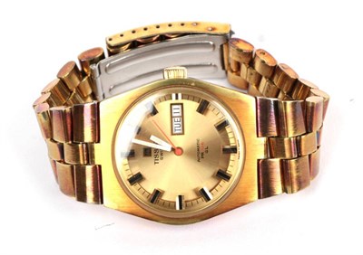 Lot 77 - A gold plated automatic calendar wristwatch signed Tissot