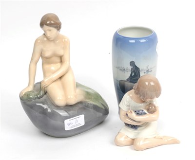 Lot 84 - A Copenhagen figure modelled as a nude bather; another Copenhagen figure of a young girl seated...