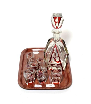 Lot 99 - ^ A ruby flash glass liqueur set comprising decanter and stopper, decorated with a bird amongst...