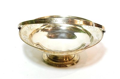 Lot 145 - A silver swing handled pedestal bowl by Barker Brothers Silver Ltd, Birmingham 1931 with...