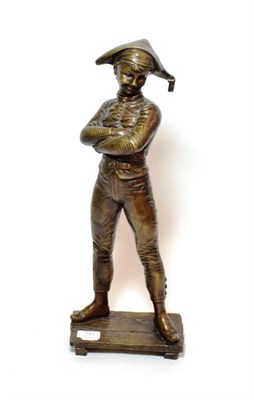 Lot 147 - ^ A modern bronze figure of a boy standing with arms crossed, 54cm high