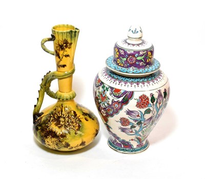 Lot 160 - ^ A reproduction Turkish vase and cover in the Isnik style and a George Jones Melrose ware ewer (2)