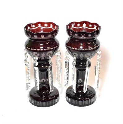 Lot 163 - ^ A pair of ruby glass drop lustres, 38cm high