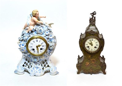 Lot 165 - A ceramic encrusted striking mantel clock and a floral decorated striking mantel clock (2)