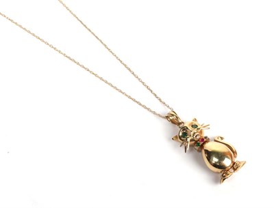 Lot 203 - A 9 carat gold articulated gemset cat pendant on a trace link chain with clasp stamped '375',...