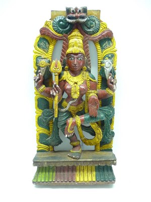 Lot 1214 - An Indian Carved and Painted Shrine, 19th/20th century, as the goddess Kali, in an oval foliate...