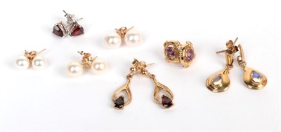 Lot 204 - Three pairs of cultured pearl earrings, stamped '375'; a pair of garnet stud earrings, stamped...