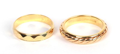 Lot 211 - Two fancy 18 carat gold band rings, both finger size M