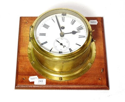 Lot 243 - A brass ships bulk head clock, single fusee movement with a platform escapement and maintaining...