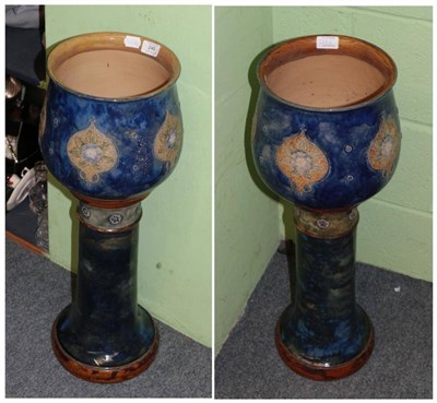 Lot 248 - A pair of Royal Doulton blue glazed stoneware jardinieres on stands