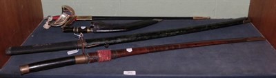 Lot 251 - A Burmese Dha & Scabbard; a Katana; a Kukri and reproduction sword (4)