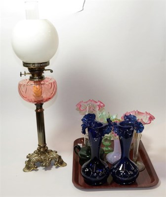 Lot 262 - A quantity of coloured glassware including vases and an oil lamp with pink glass reservoir