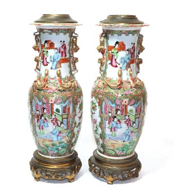 Lot 269 - A pair of 19th century Canton Famille rose vases, converted to table lamps with gilt metal mounts