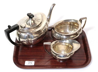 Lot 274 - A three piece silver tea service, J & W Deakin, Sheffield 1911/12, the teapot 28cm long,...