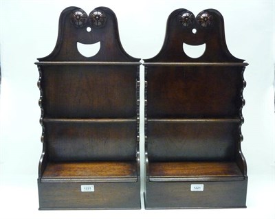 Lot 1221 - A Pair of George II Style Mahogany Spoon Racks, the broken arched cresting with rosette...