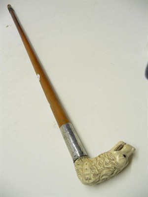 Lot 1225 - An Ivory and Silver Plate Mounted Walking Cane, circa 1881, the handle carved as a dog's head...