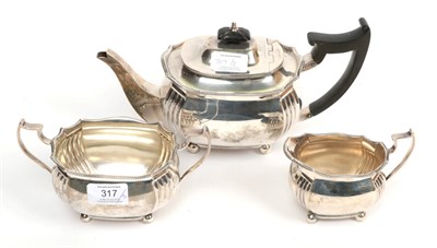 Lot 317 - A three piece silver tea service, Edward Barnard & Sons, London 1917/18, the teapot 28.5cm...