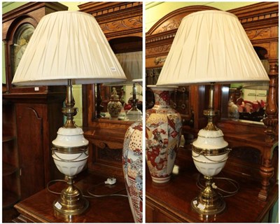 Lot 331 - ^ A large pair of brass and ceramic table lamps with shades, 88cm high