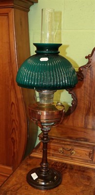 Lot 333 - A turned wooden and copper oil lamp with green glass shade