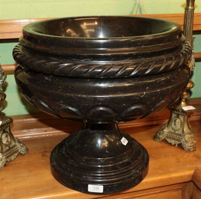 Lot 336 - ^ A carved black marble planter, 45cm diameter